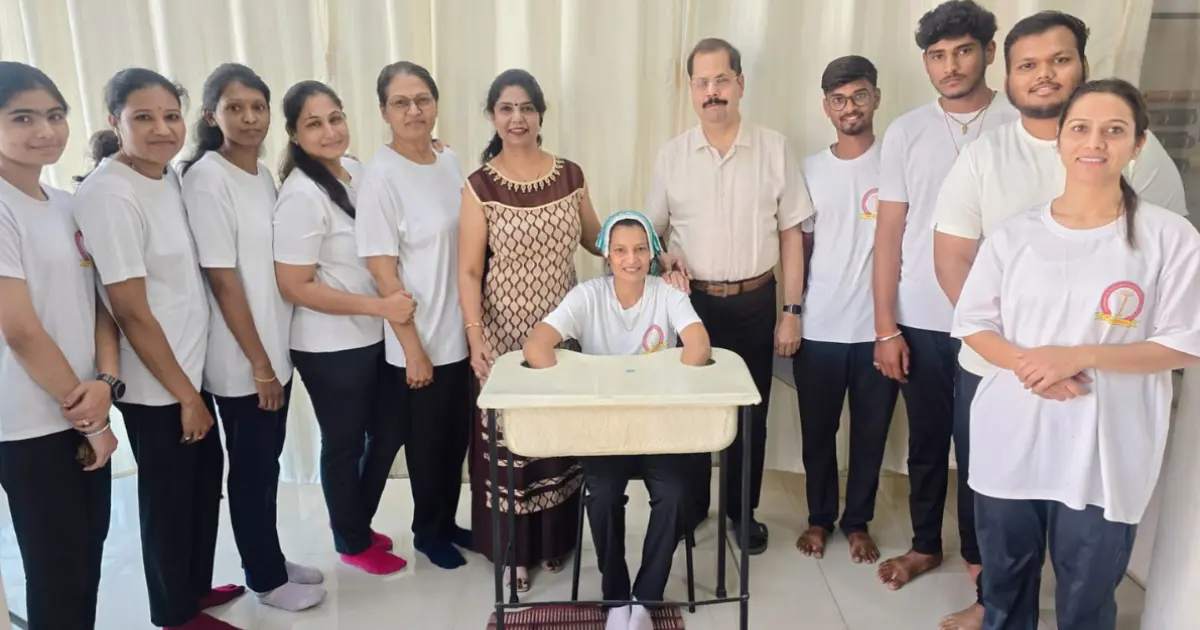 Yoga instructor guiding students in correct asana posture
